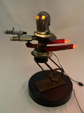 Steampunk-style robot figure with glowing eyes and red lights on a white background