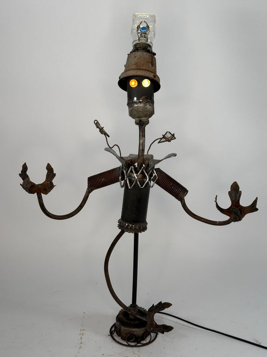 Clowny original sculptural lighting by Bobby Anderson with spring-loaded arms, glowing marble eyes, and illuminated glass top