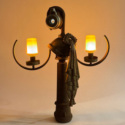Goddess Idea illuminated found object sculpture made from antique metal parts by Bobby Anderson