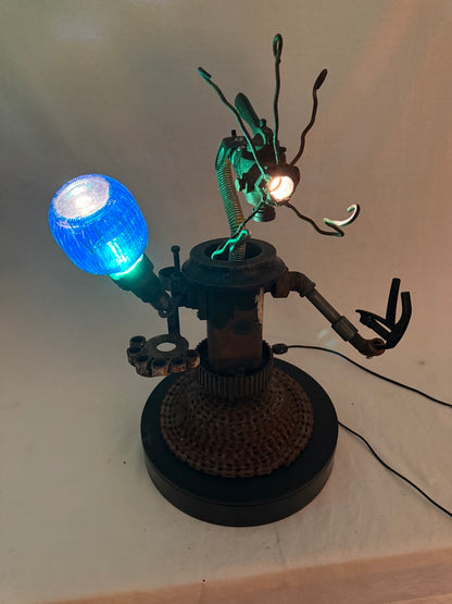 Master Kang original sculptural robot lamp by Bobby Anderson with illuminated glass orb, flexible head, clamp, and artist tool holders. RVA246