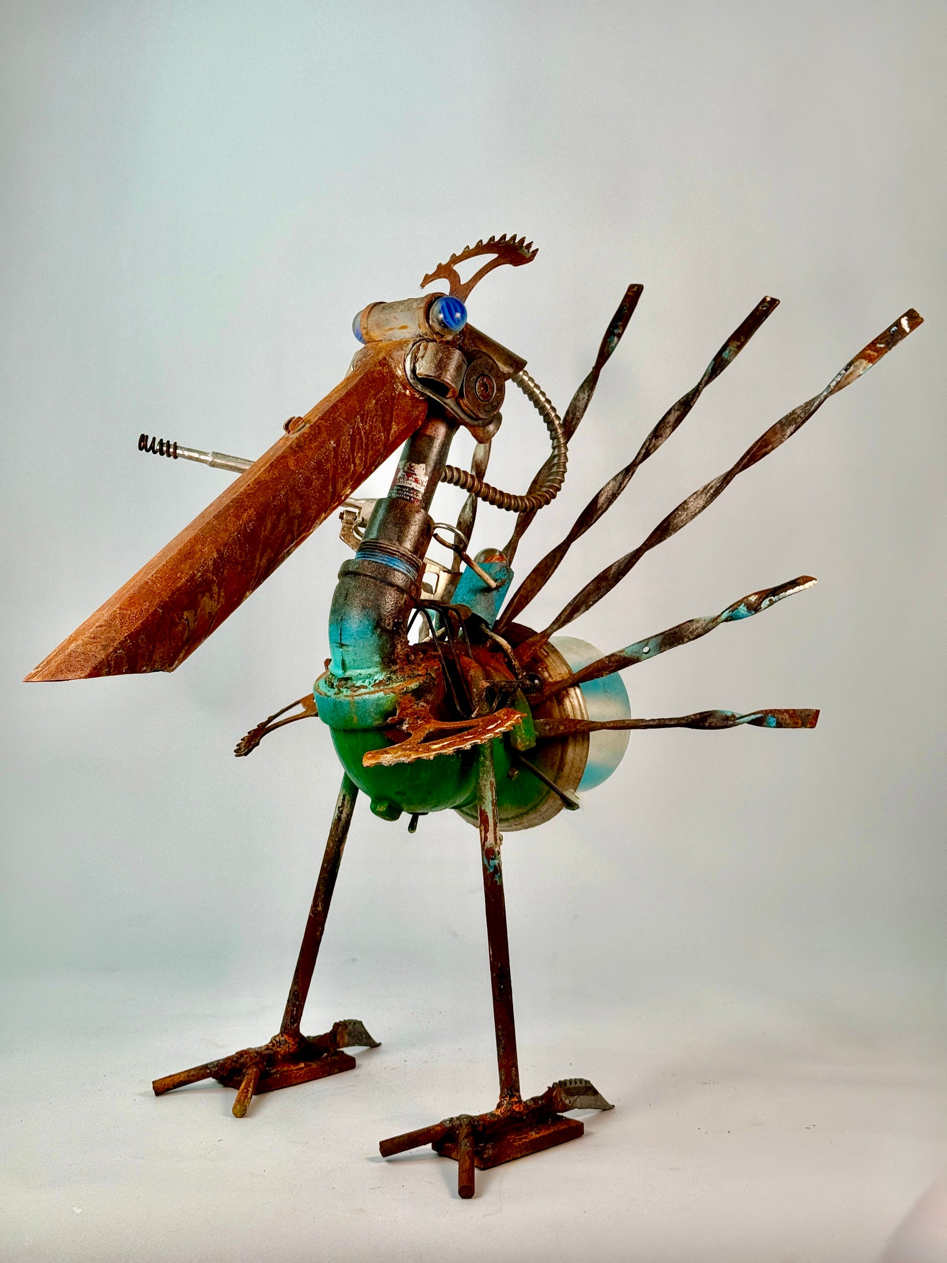Battle Bird reclaimed metal bird sculpture with sprocket feathers and alien sniper bot rider