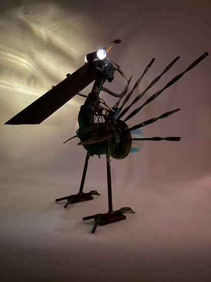 Battle Bird illuminated reclaimed metal bird sculpture with sprocket feathers and alien sniper bot rider