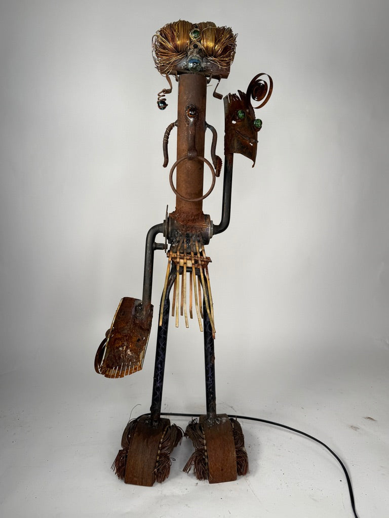 Shaman original sculptural lighting by Bobby Anderson with spinning mask arms, illuminated headdress, and reclaimed metal construction, RVA246