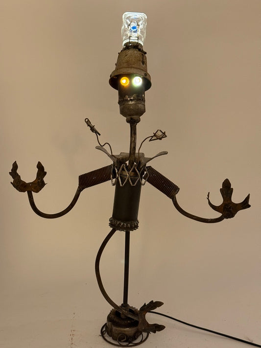 Clowny original sculptural lighting by Bobby Anderson with spring-loaded arms, glowing marble eyes, and illuminated glass top