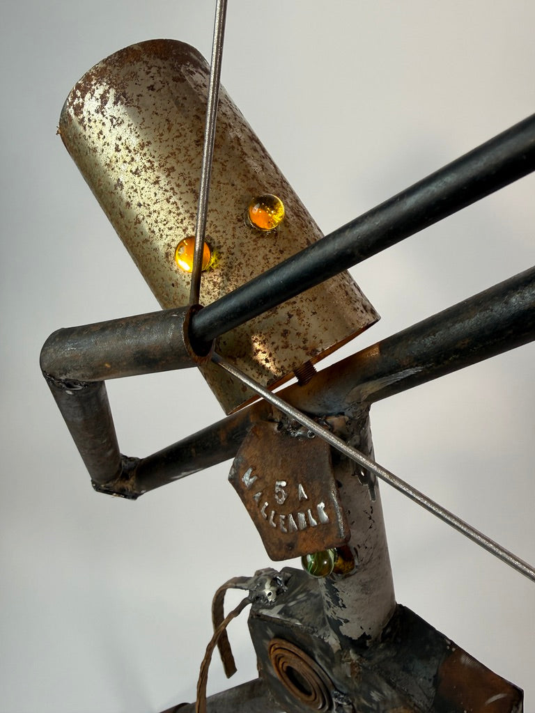 Reclaimed metal and found object details on The First Draw sculptural lighting by Memphis artist, Bobby Anderson