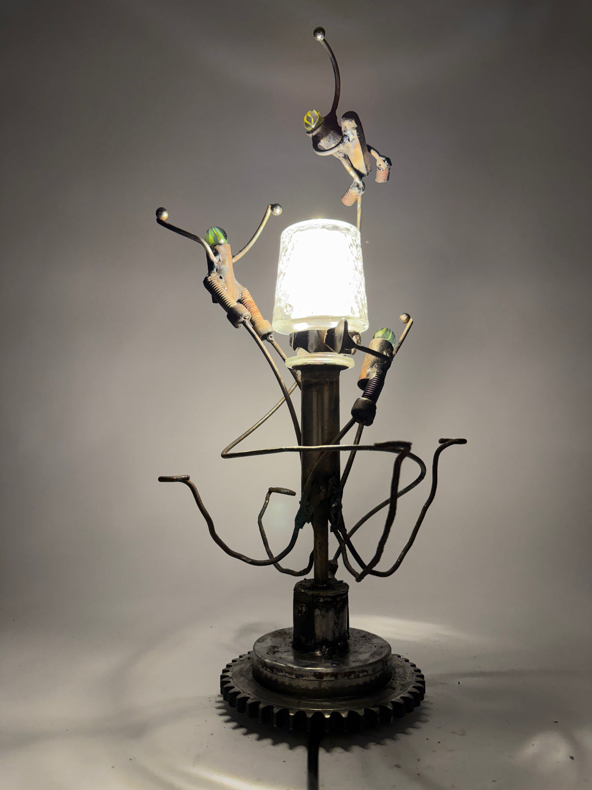 Moon Ball Lamp reclaimed metal robot sculptural lighting with three orbiting figures by Bobby Anderson
